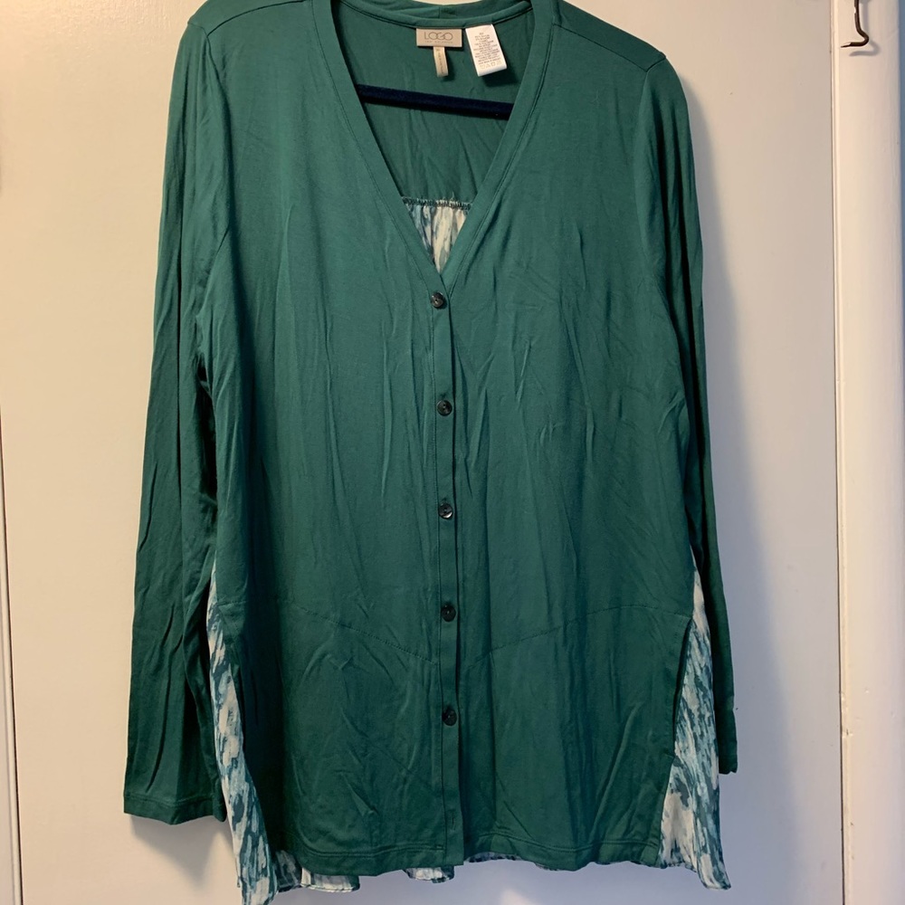 Beautiful silky top with a high low style. Back panel is a sheer flowy insert.